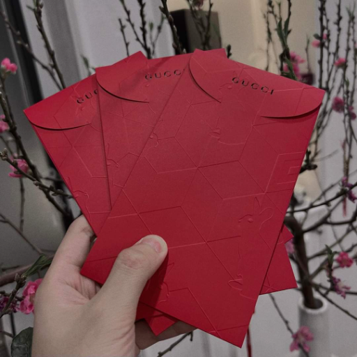 muffled-bat943: a person holding a bunch of red envelopes, instagram  contest winner, gucci, dressed in red paper bags, giving gifts holding  gift, 3 colour, from china, gifts, invitation card, gucci, guccimaze, 1 
